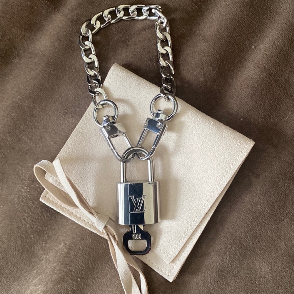 # 305 Very Rare LV silver lock with key